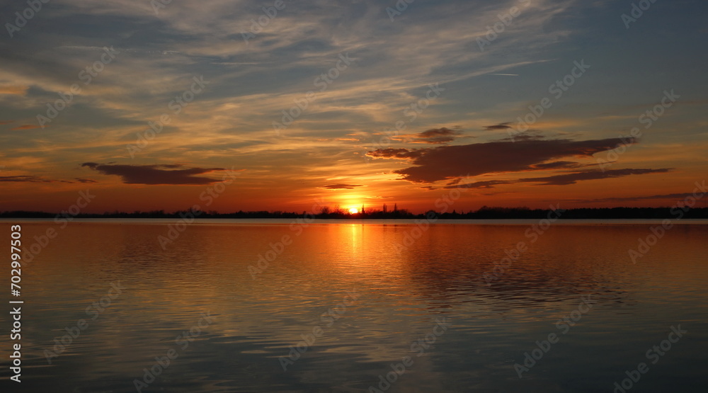 sunset on the lake with clouds