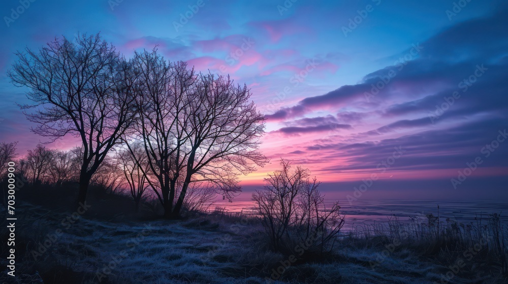 A breathtaking view of the sunrise during the blue hour, creating a serene atmosphere with the sky painted in hues of blue and purple.
A breathtaking view of the sunrise during the blue hour, creating a serene atmosphere with the sky painted in hues of blue and purple.