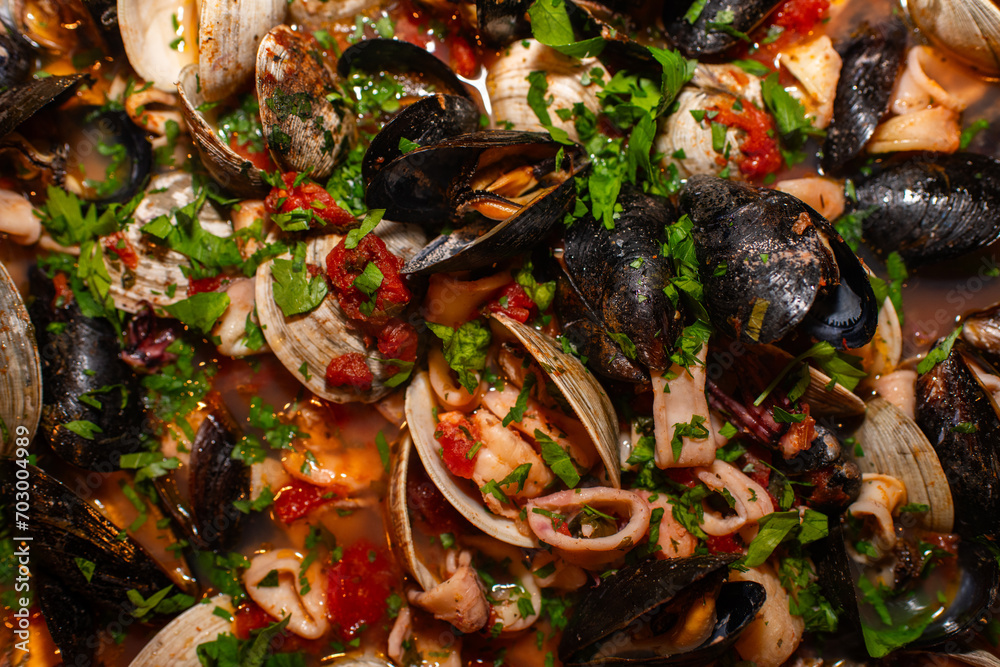 Seafood Soup with tomato sauce and parsley Seafood Soup with tomato sauce and parsley