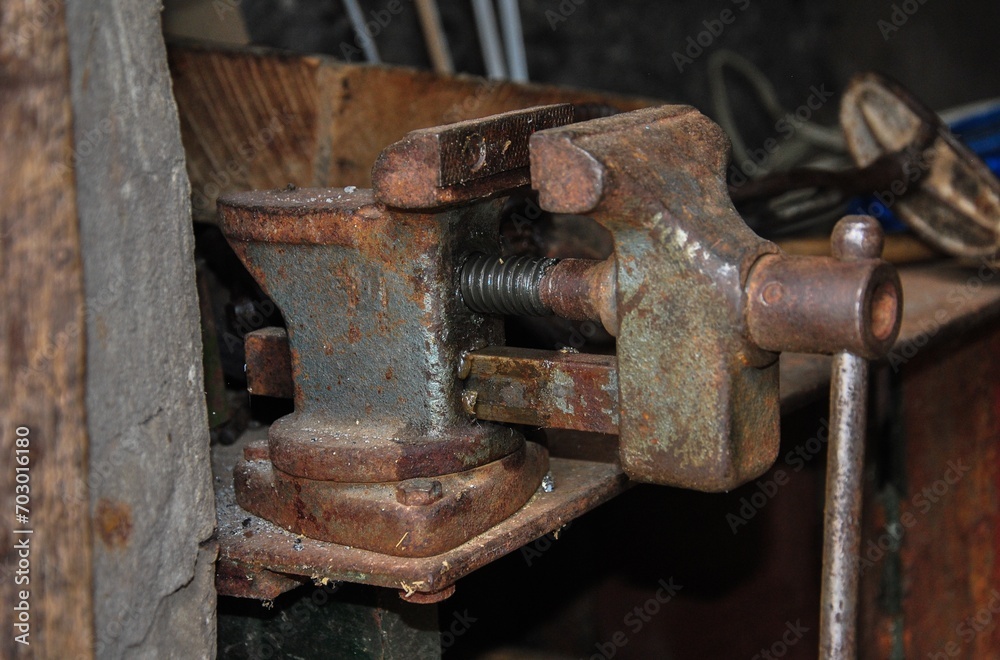 old bench vice. Close-up view of a mechanic's vice at the foreman's workplace.