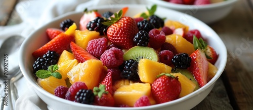 Tasty fruit salad with chosen topping and dressing