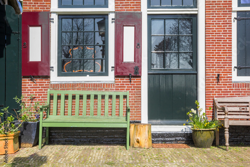Bench in front of an old house in Zaanse Schans, Netherlands photo