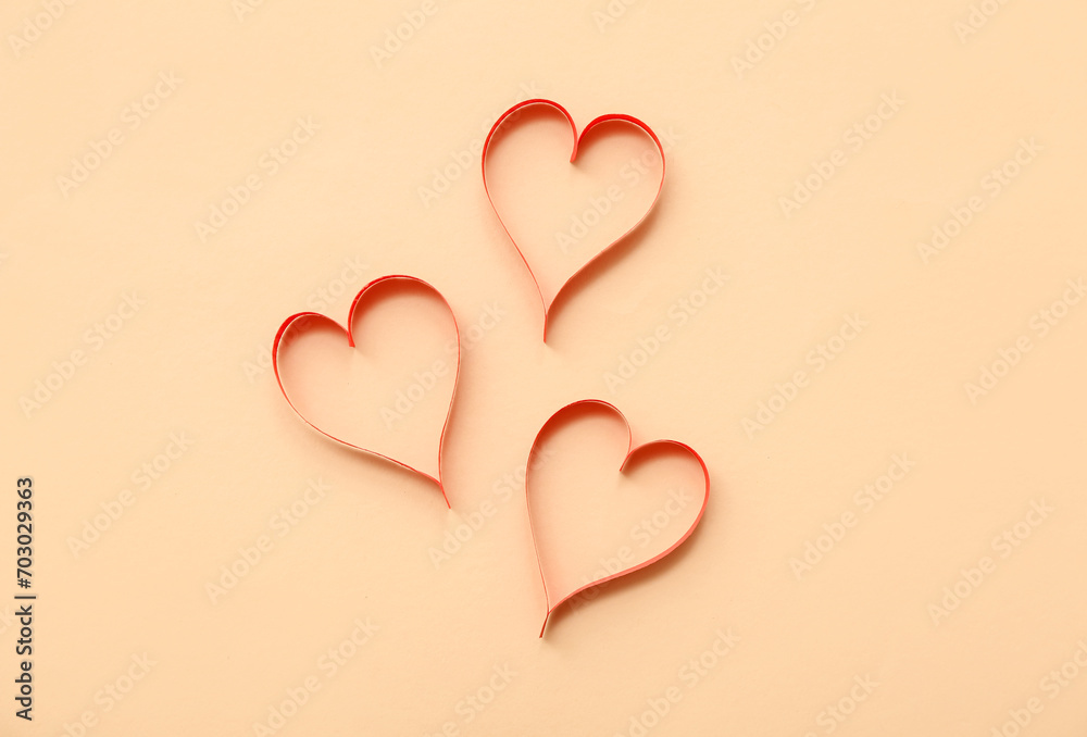 Set of red paper hearts on color background. Valentine's Day celebration