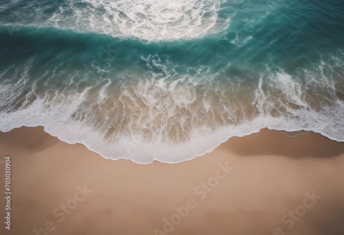 Beach sand with transparent ocean water Photo taken from above © FrameFinesse