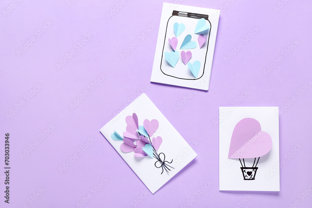 Beautiful greeting cards for Valentine's Day celebration on lilac background