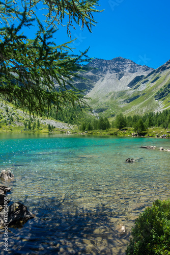 Morgex, Italy, 10 July 2022: The beautiful crystal clear water of the Arpy Lake in Aosta Valley