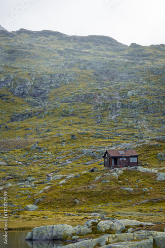 Wooden hut in the Norwegian  mountains, moody landscape in the trail for Trolltunga