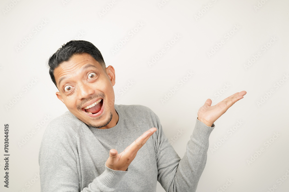 surprised, shocked expression of Asian Man with hand point, isolated background surprised, shocked expression of Asian Man with hand point, isolated background