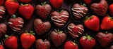 Assorted chocolate-covered strawberries in heart-shaped packaging.