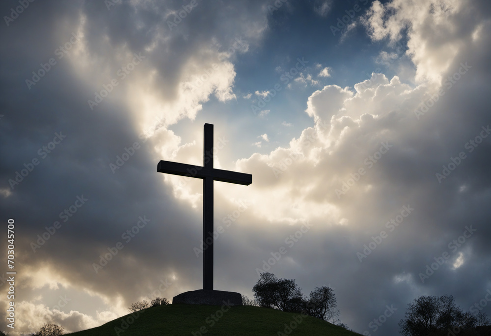A beam of light filtering through a bright sky and flowing clouds, casting a silhouette of the holy cross symbolizing the crucifixion, death, and resurrection of Jesus Christ