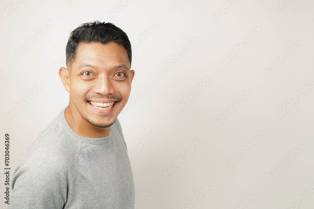 Asian man expression with happy laughing face, isolated background Asian man expression with happy laughing face, isolated background
