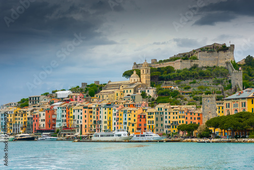 Beautiful view of the colorful town of Portovenere with the castle and cloudy sky  view from the sea  Liguria   Italy