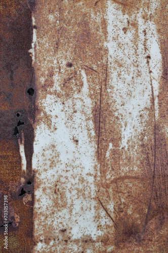 Old light blue grey painted rusty brown rustic iron metal plate background texture, vertical aged damaged weathered scratched punctured plain paint pattern, grunge textured copy space macro closeup