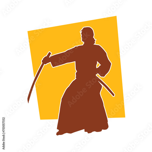 Silhouette of a sword warrior in action pose. Silhouette of a martial art person carrying sword weapon. Silhouette of kendo martial art pose.