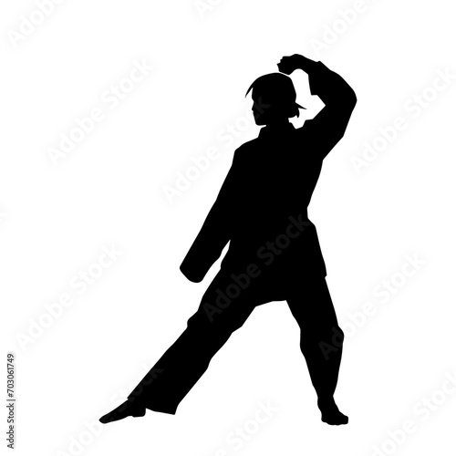 Silhouette of a slim female doing martial art pose. Silhouette of a martial art woman in action pose.