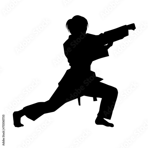 Silhouette of a slim female doing martial art pose. Silhouette of a martial art woman in action pose.