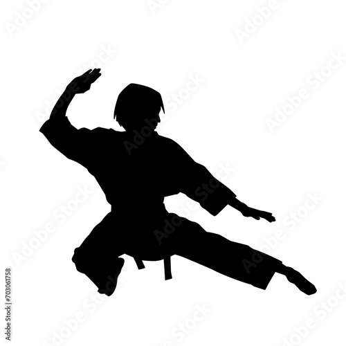 Silhouette of a slim female doing martial art pose. Silhouette of a martial art woman in action pose.