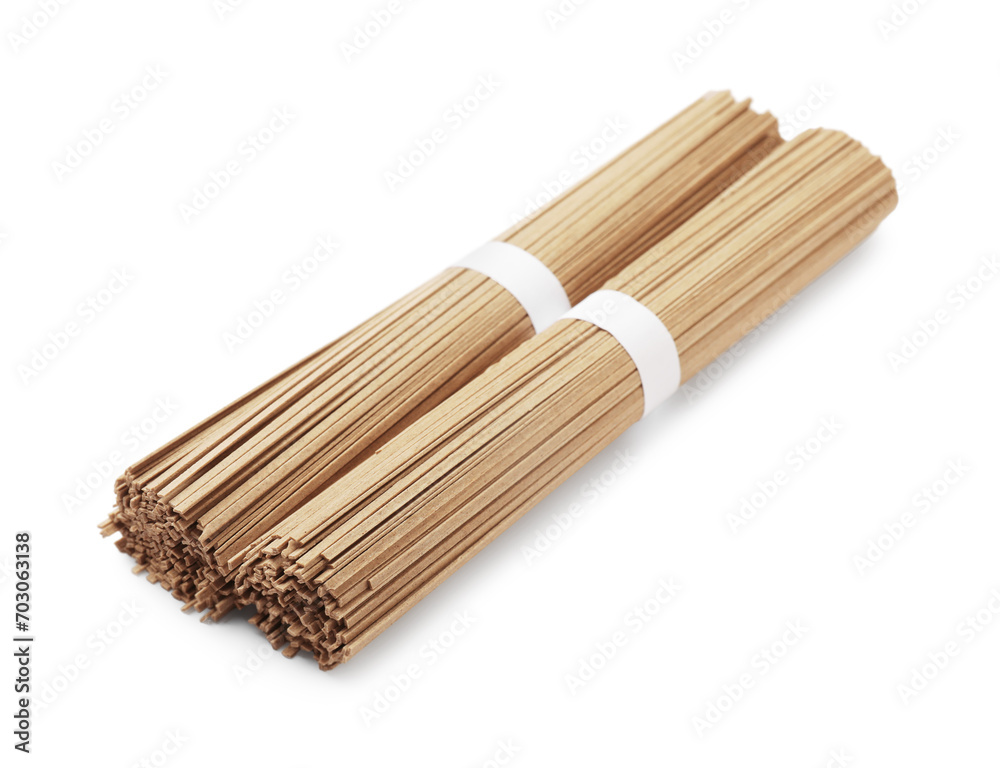 Uncooked buckwheat noodles (soba) isolated on white Uncooked buckwheat noodles (soba) isolated on white