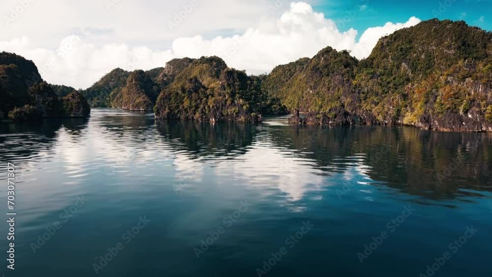 Flight over the water in Raja Ampat region in Indonesia Flight over the water in Raja Ampat region in Indonesia