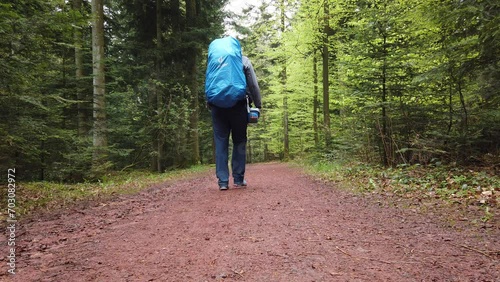 Man hiking the popular long-distance trail Westweg through the Black Forest in southern Germany photo