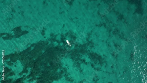 Wallpaper Mural Slow motion top down aerial view of fishing boat in vast open ocean Torontodigital.ca