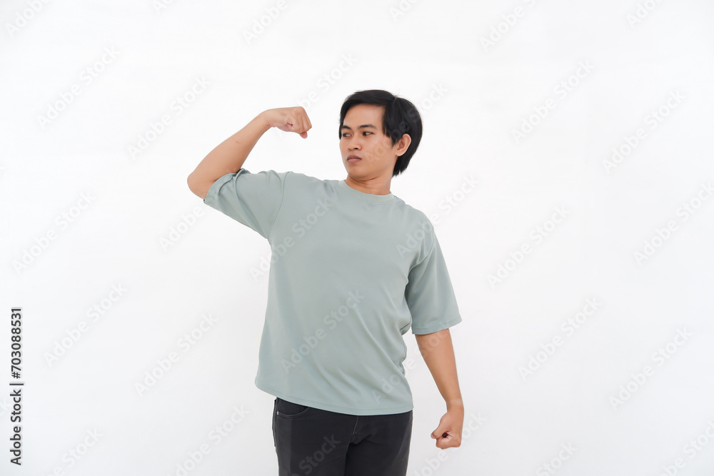 Young Asian Man Raises Hand, Expressing Strength with Varied Emotions from Smiles to Anger Young Asian Man Raises Hand, Expressing Strength with Varied Emotions from Smiles to Anger