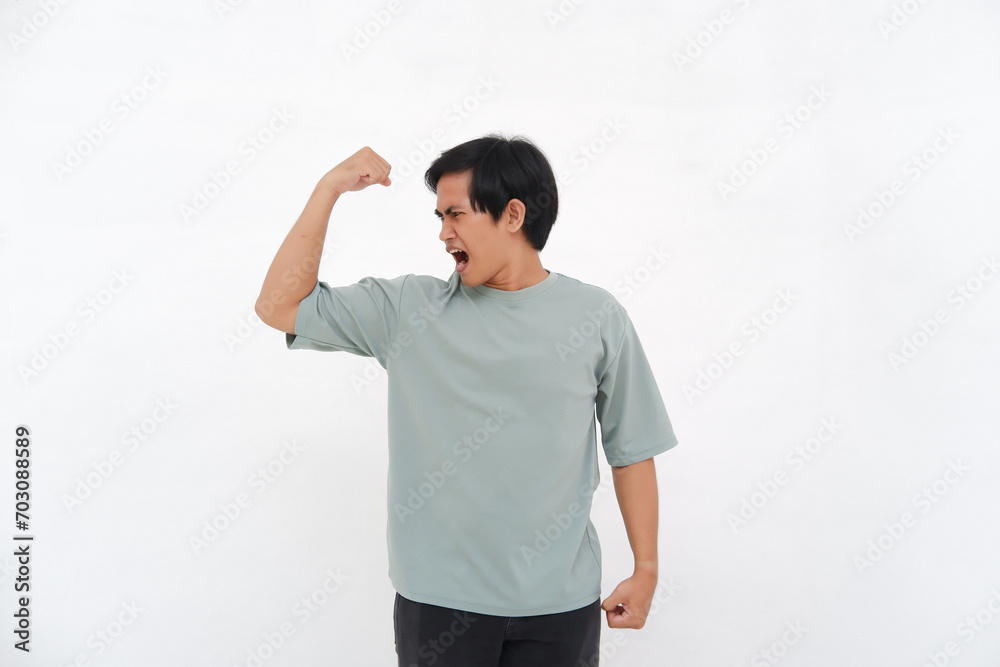 Young Asian Man Raises Hand, Expressing Strength with Varied Emotions from Smiles to Anger