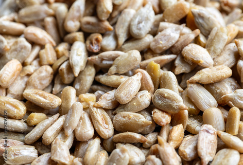 close up of a shelled sunflower seeds background