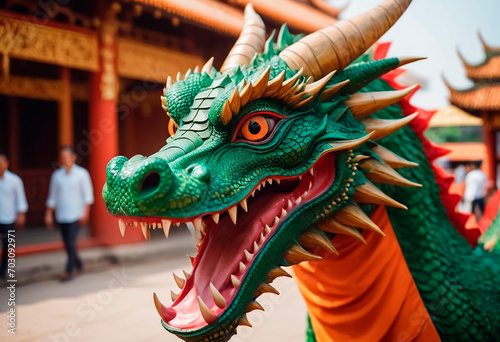 Colorful wooden carved dragon symbol of the Chinese New Year © Yulia