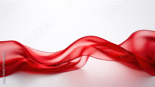 A luxurious wave of red silk fabric elegantly draped, creating a flowing motion against a clean white background.