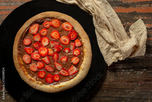 .delicious chocolate and strawberry pizza. sweet pizza