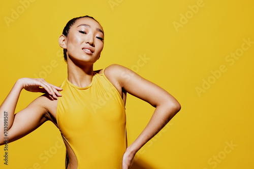 Woman trendy face beauty yellow summer surprised smile fashion attractive swimsuit portrait photo