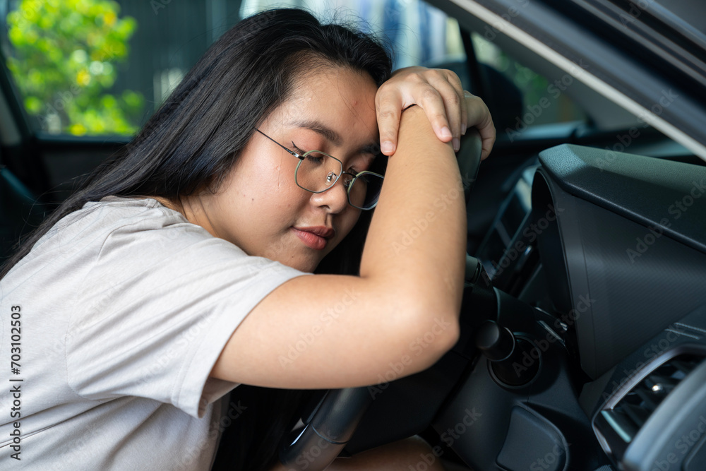 Young woman Asian are feeling sleepy while driving Young woman Asian are feeling sleepy while driving