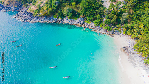 Paradise beach Phuket Patong. aerial top view amazing freedom beach small white sand beach with perfect nature. white wave hit the rock around island. green forest peaceful. green sea, landscape.