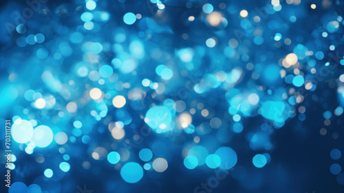 Abstract background texture of sparkling blue bokeh lights, evoking a magical, festive atmosphere.