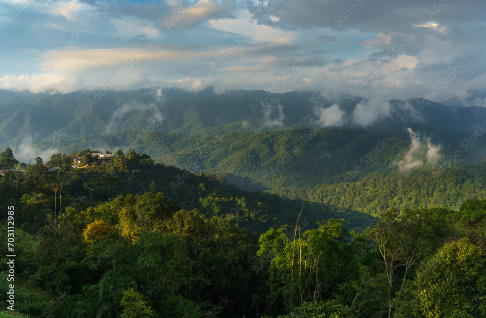 Natural scenery of tropical forest in the morning with mountain range at Doi Luang Chiang Dao, Chiang Mai, Thailand
