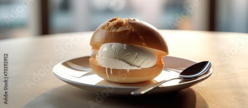 Ice cream on bread bun in white bowl on table