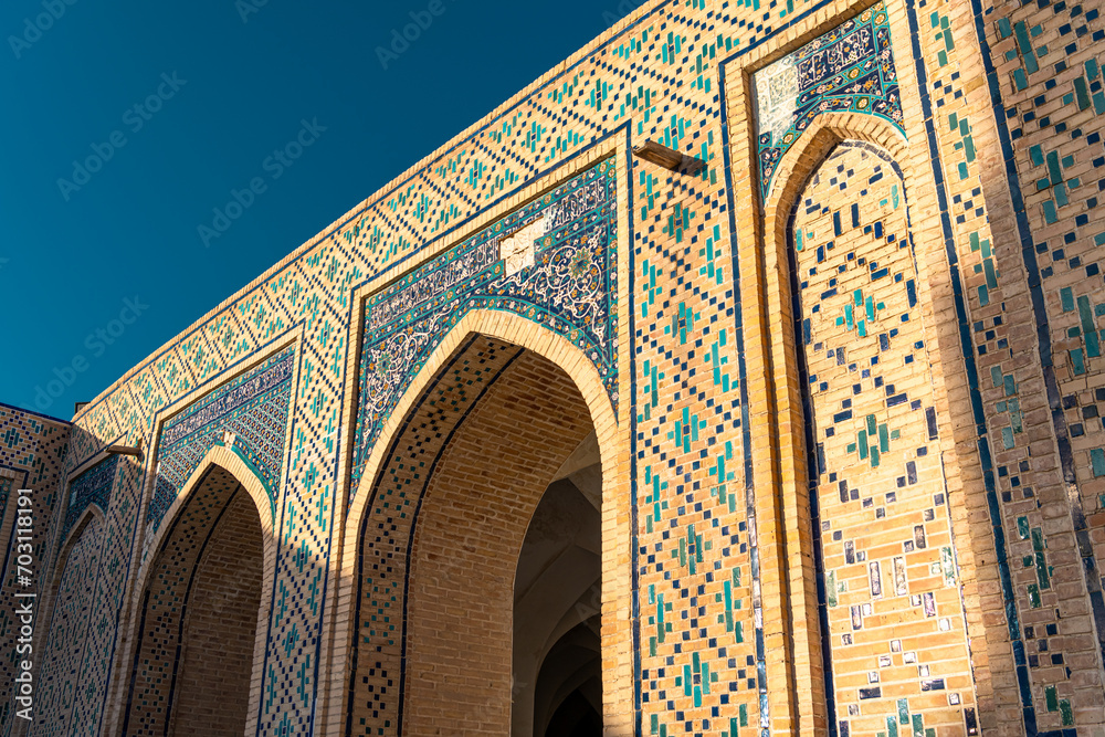 Bukhara, Uzbekistan. View of the entrance of Kalon madrasah during the sunset