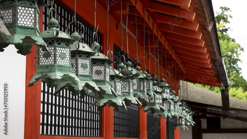 Hanging bronze lanterns at Kasuga Taisha shrine in Nara Japan photo