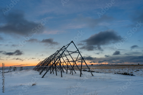 An old fish drying rack at the coast of the Varanagerfjord on a cold winter day during the polar night, Ekkerøya, Northern Norway © Esa