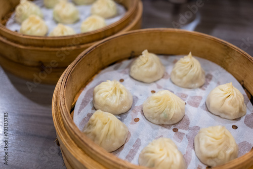 Steamed xiaolongbao served in a traditional steaming basket