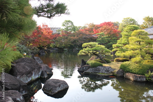 Autumn leaves and pond in the Garden of the Lord's Residence in Koko-en Garden, Himeji, Japan photo