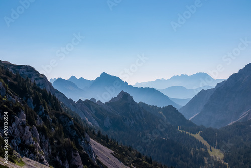 Scenic view of mountain peak Grintovec in majestic Kamnik-Savinja Alps, Slovenia, Europe. Magnificent Hiking trail on Loibl Pass in untamed Karawanks, Austrian border. Magical mountains Slovenian Alps © Chris