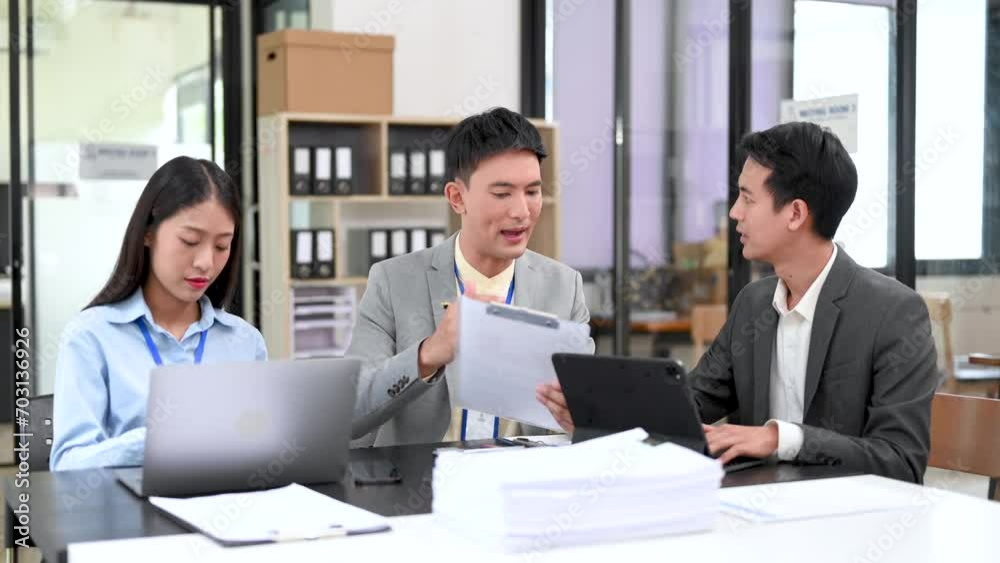Young business creative team are brainstorming planning discussing while sitting in creative business discussing work Young business creative team are brainstorming planning discussing while sitting in creative business discussing work
