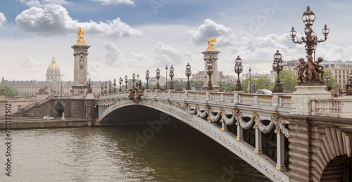 Fototapeta Naklejka Na Ścianę i Meble -  Panorama with Pont Alexandre III Bridge and overlooking the old city, cloudy day. France Paris
