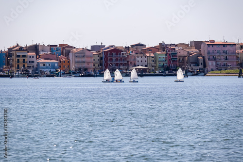 Sailing boat regatta in the picturesque bay nestled between the idyllic towns of Chioggia and Sottomarina, located in the captivating Venetian Lagoon of Veneto, Italy. Vacation Mediterranean sea