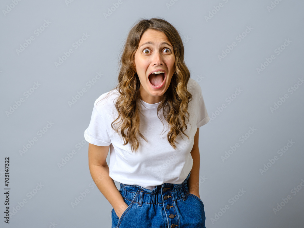 Portrait of young pretty surprised woman with opened mouth isolated Portrait of young pretty surprised woman with opened mouth isolated