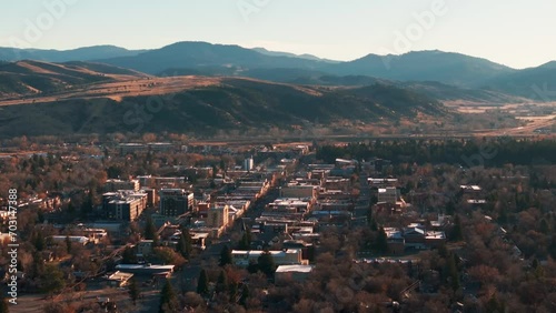 Static drone shot viewing downtown Bozeman, Montana at sunrise in the fall photo
