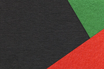 Texture of craft black color paper background with green and red border. Vintage abstract cardboard.