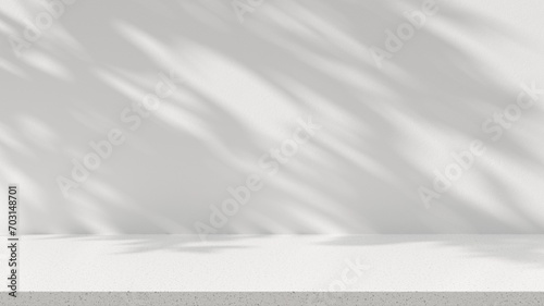 Empty space stone table top on white wall background with tree shadow sunlight. Mockup scene display for products presentation. 